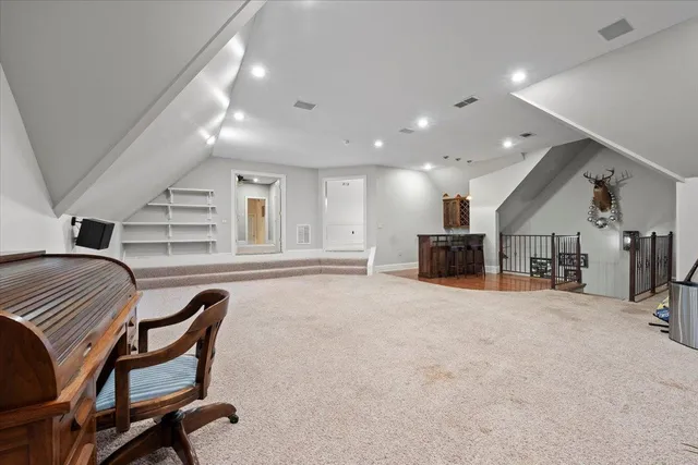 a view of a windows and chandelier in hallway