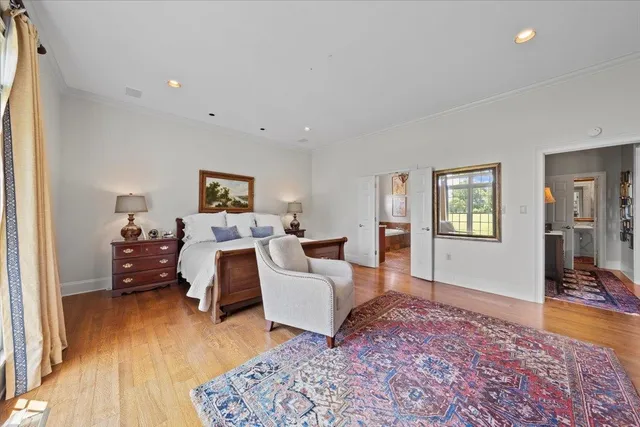 a bed room with a bed and wooden floor