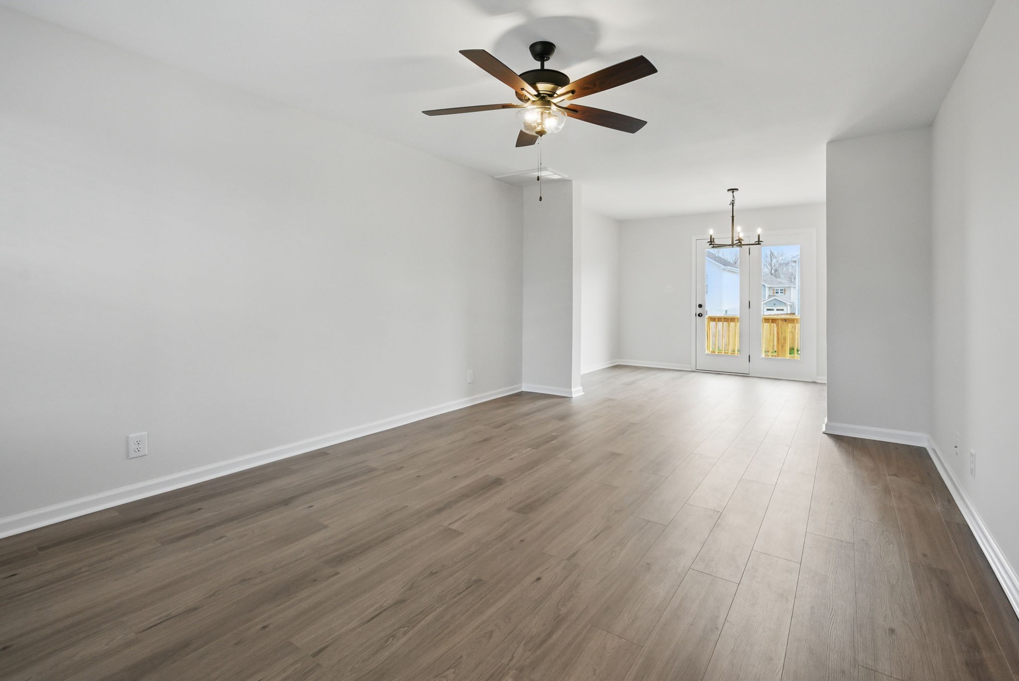 180 Quarry Rdg Road Clarksville, TN 37043 - Photo 4 of 8 a view of an empty room with a window and wooden floor