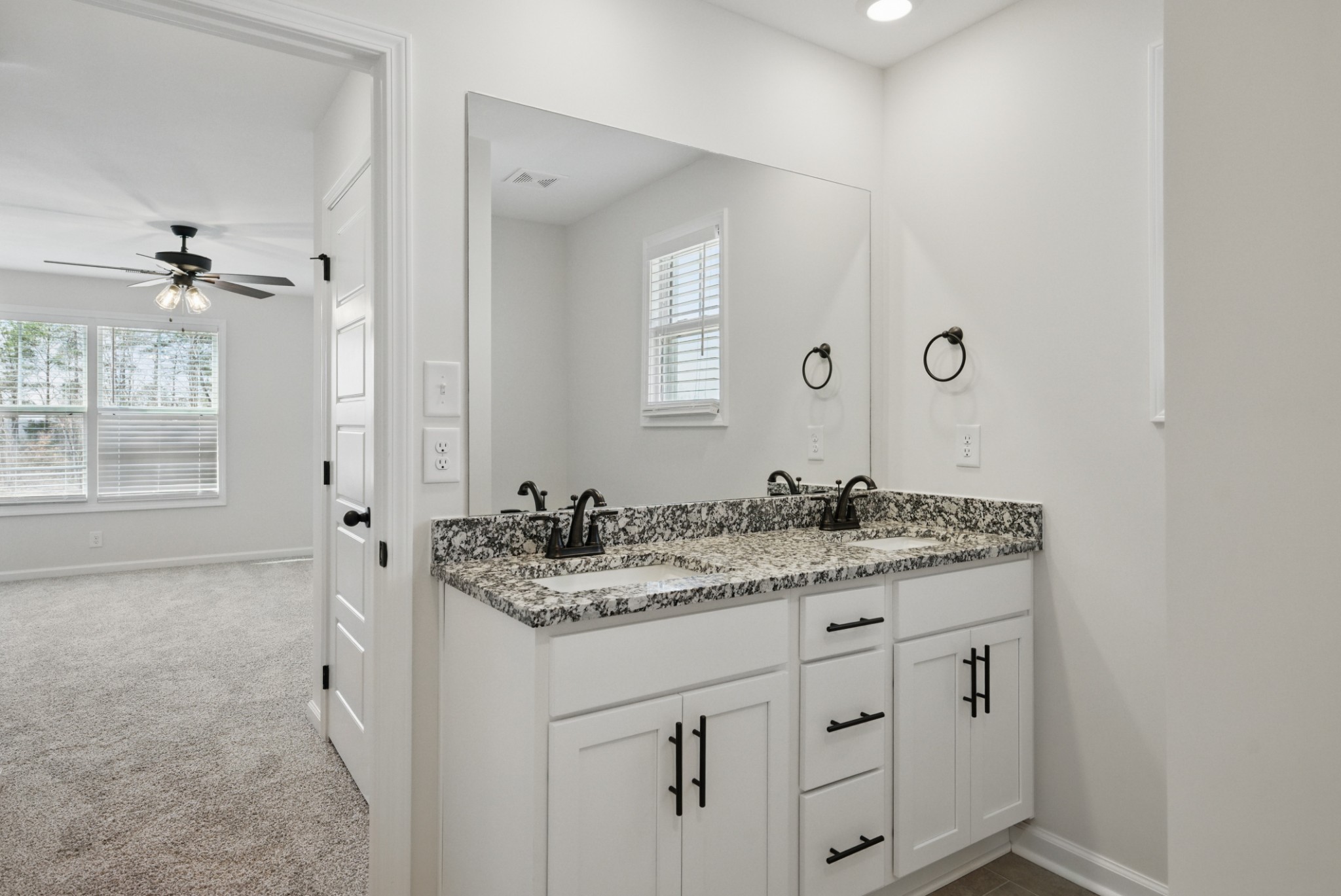 180 Quarry Rdg Road Clarksville, TN 37043 - Photo 5 of 8 a bathroom with a granite countertop sink a mirror and a