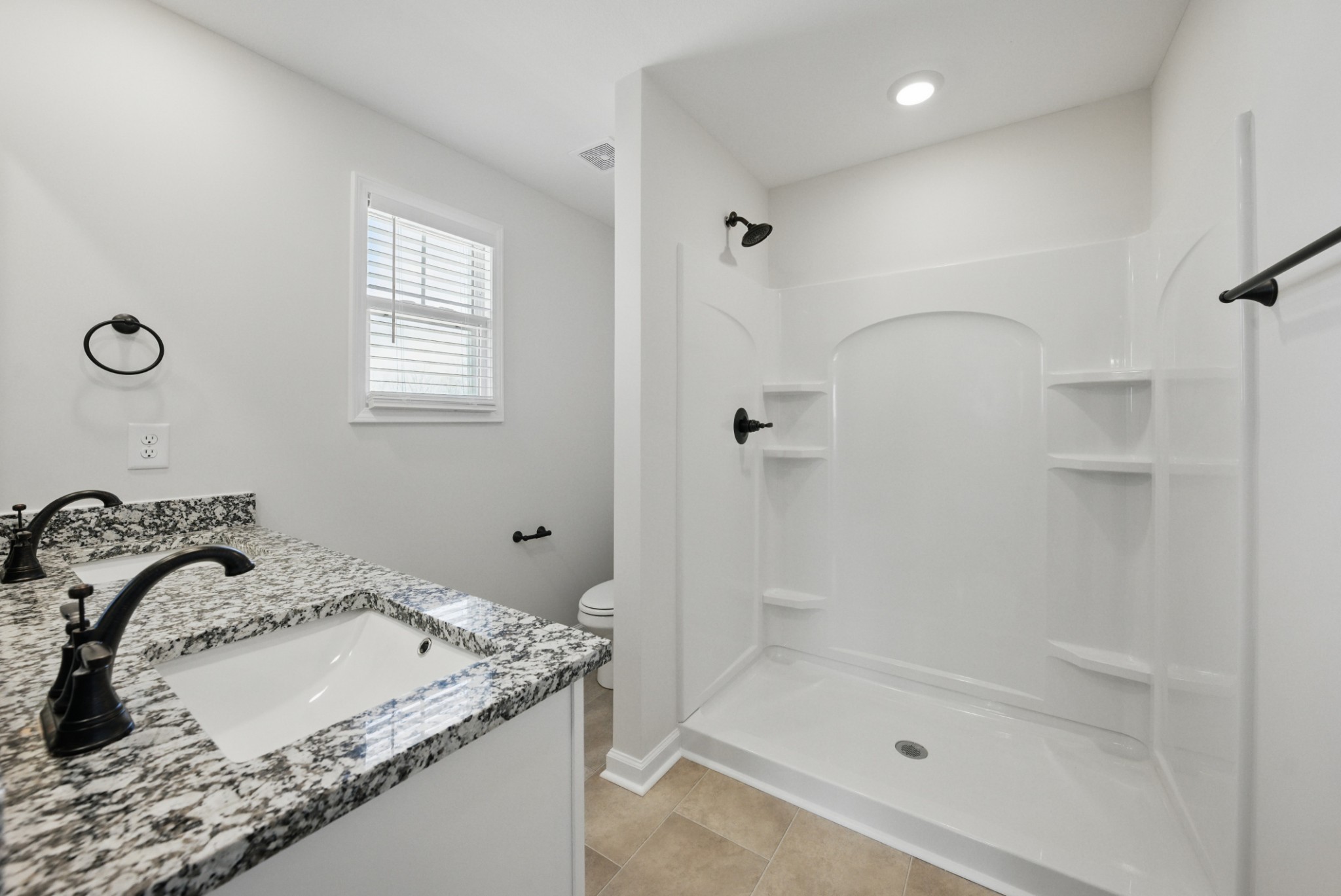 180 Quarry Rdg Road Clarksville, TN 37043 - Photo 6 of 8 a bathroom with a granite countertop sink and a mirror