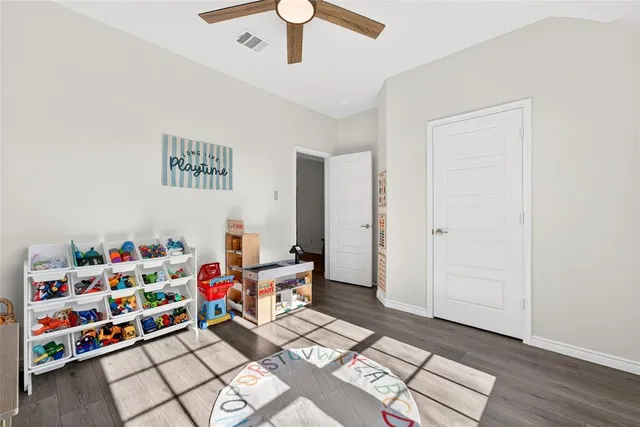 a view of walk in closet with clothes