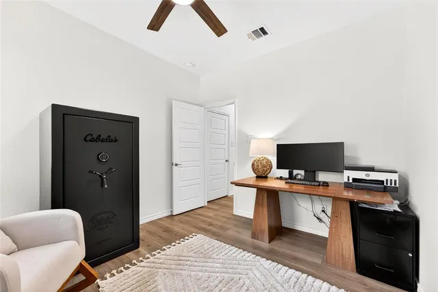 a bedroom with a bed and cabinets
