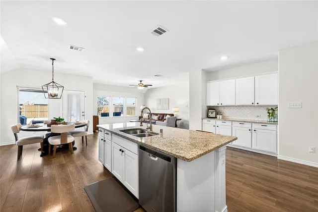 an aerial view of a swimming pool patio and lake view