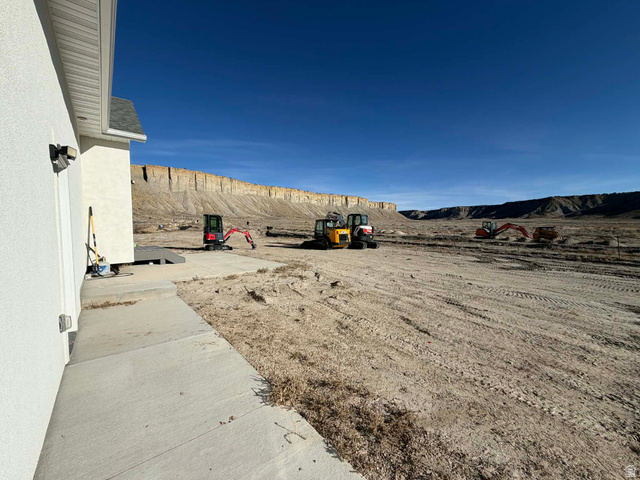 2350 North 1075 West Helper, UT 84526 - Photo 39 of 49 View of yard with a mountain view and a patio