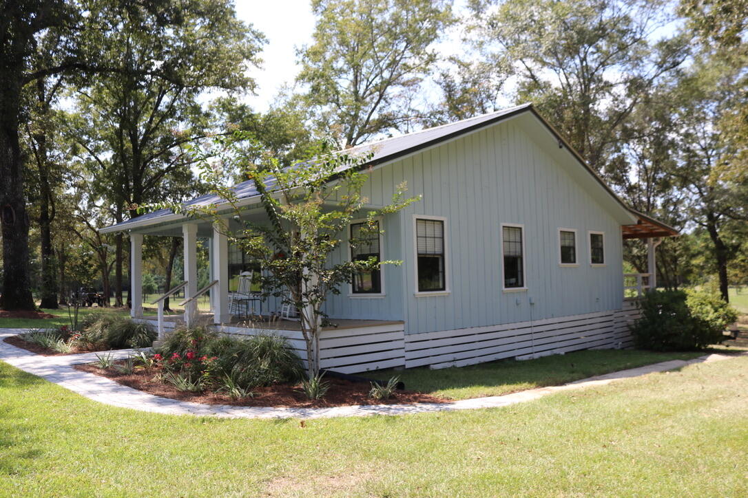 261 Wilkerson Road DeFuniak Springs, FL 32433 - Photo 7 of 15 a view of a house with a yard