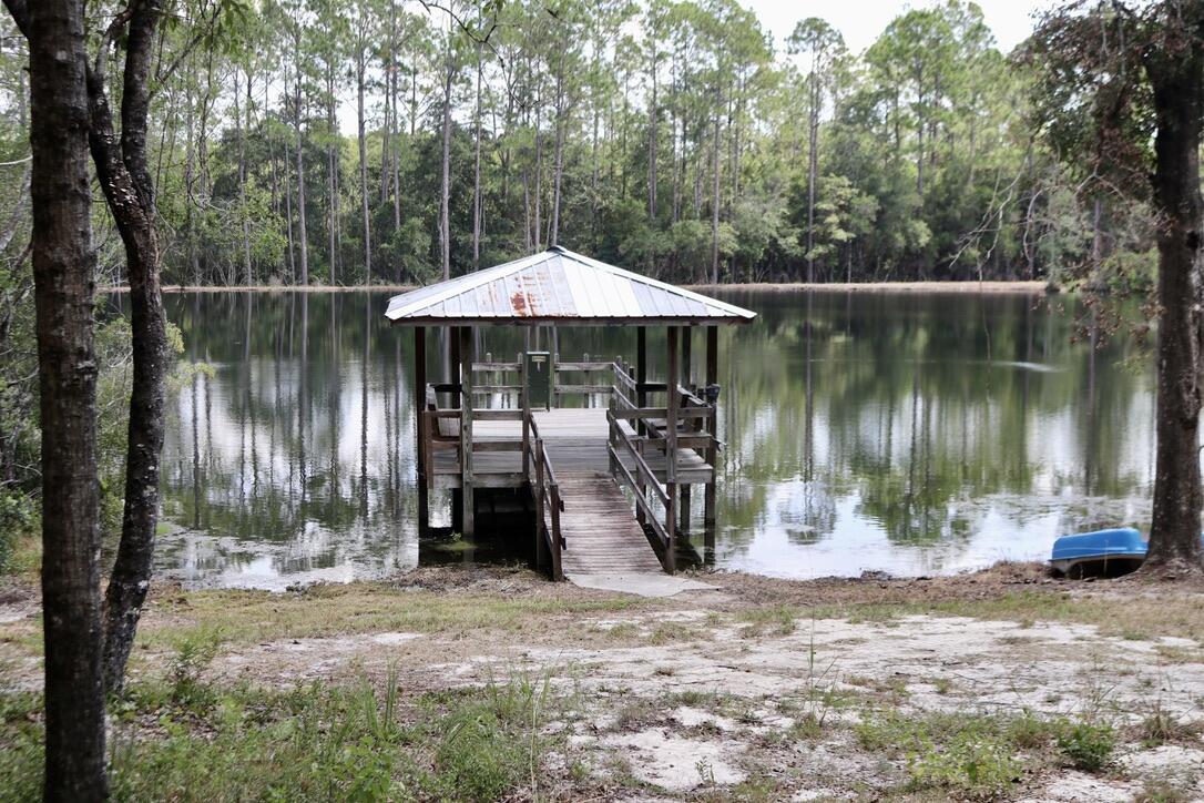 261 Wilkerson Road DeFuniak Springs, FL 32433 - Photo 10 of 15 a front view of a house with garden