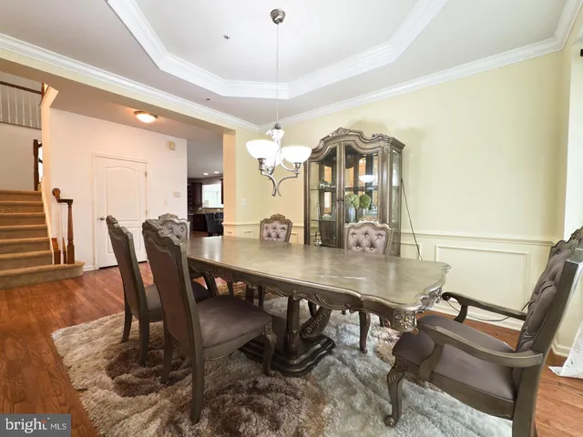 a kitchen with stainless steel appliances granite countertop a stove a refrigerator and a stove