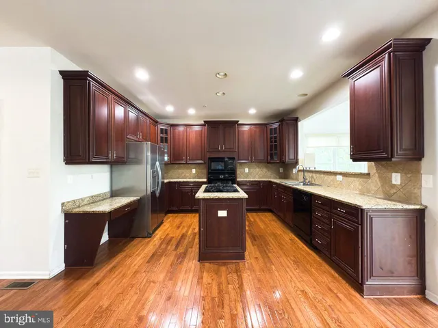 a bathroom with a toilet and a mirror