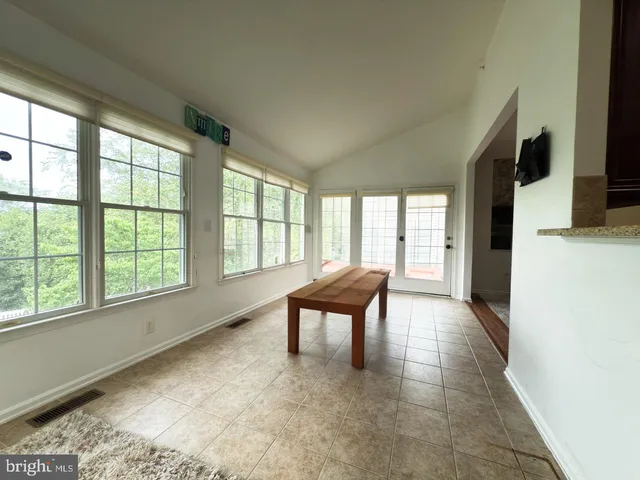 a view of a room with a large window