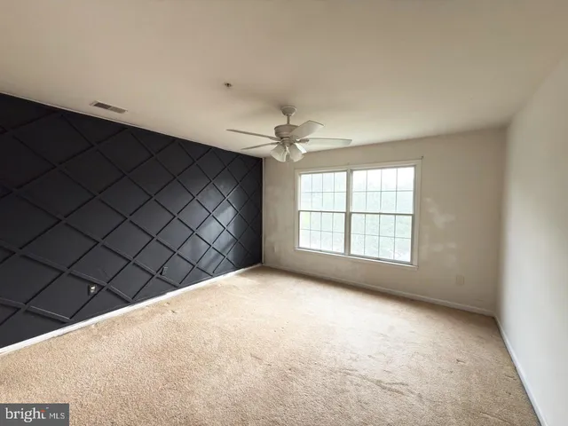 a bathroom with a sink toilet vanity and shower