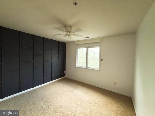 a bathroom with a double vanity sink toilet mirror and shower