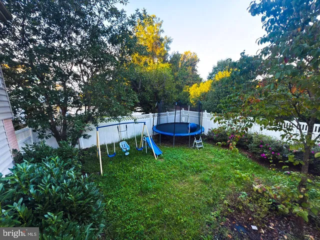 a view of a house with backyard porch and sitting area