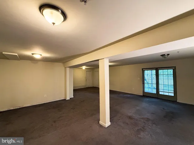 an empty room with a empty space and window