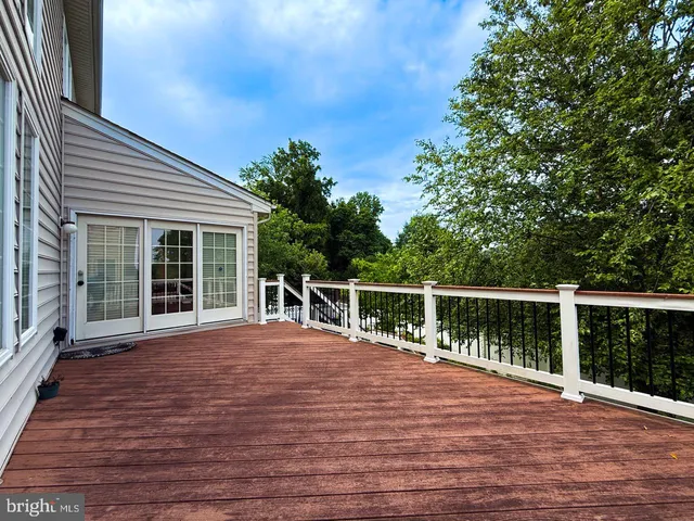 a view of a hallway with a couch and a window