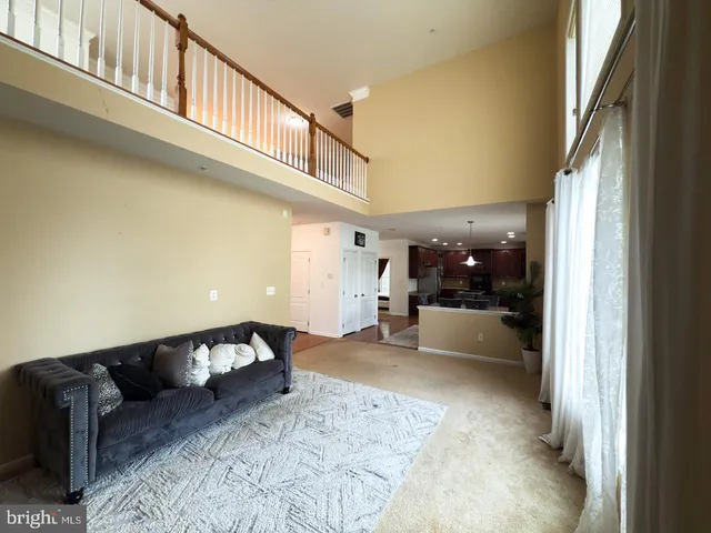 a view of an empty room and a window