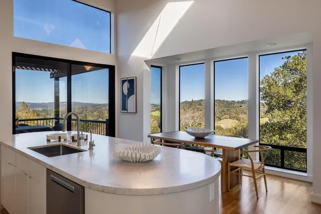 a kitchen with a table and chairs in it