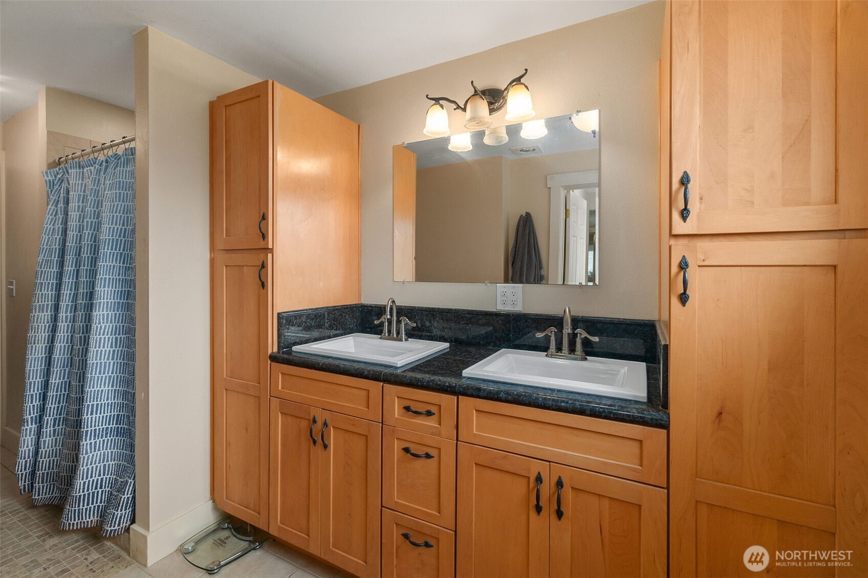 912 Middle Satsop Road Montesano, WA 98563 - Photo 12 of 37 a bathroom with a double vanity sink and a mirror