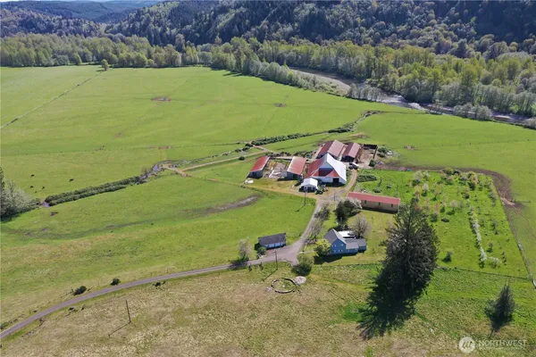 an aerial view of a houses with a yard