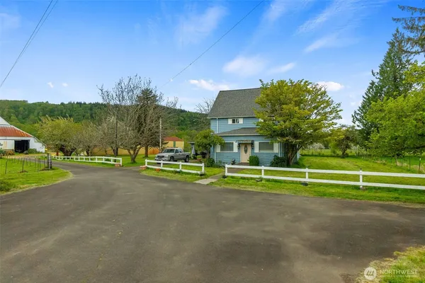 a view of a garden with wooden fence