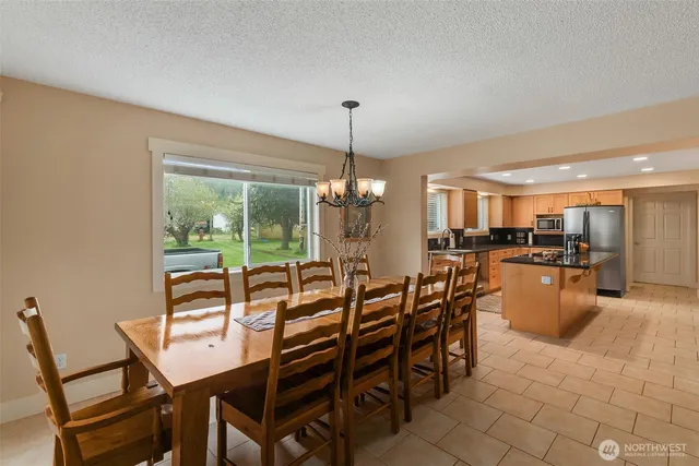 a view of a dining room with furniture window and outside view