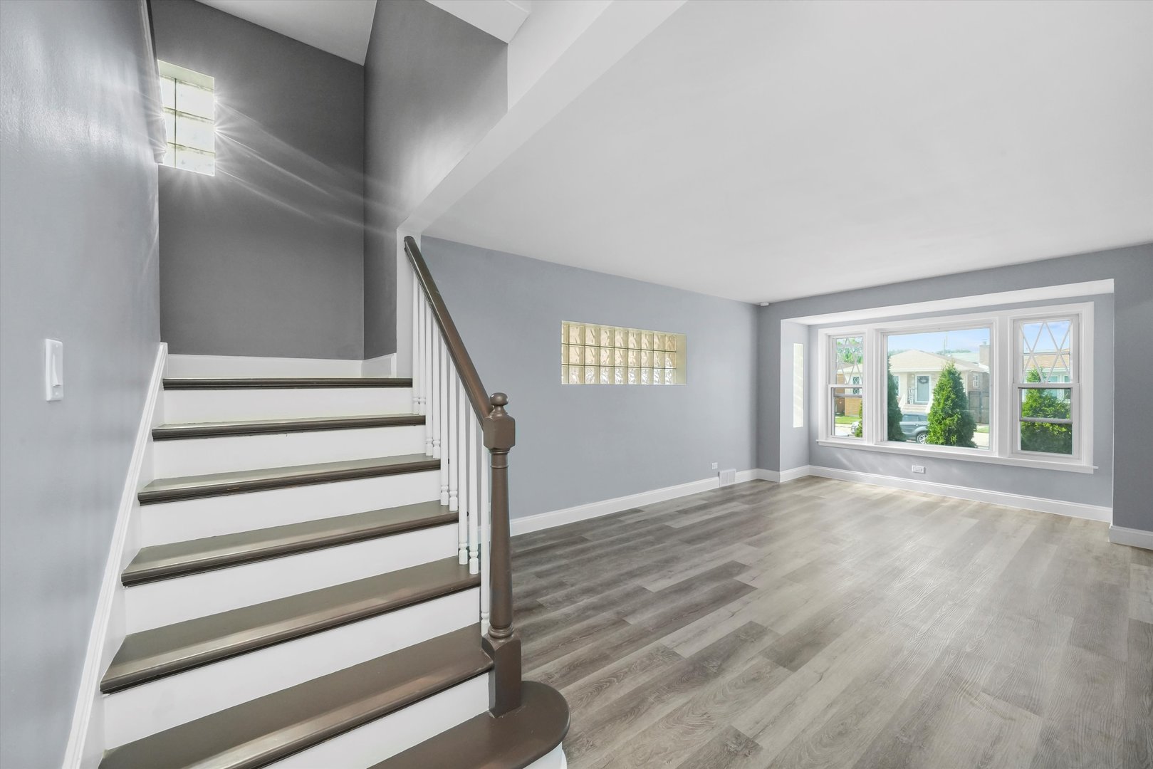 4353 West Marquette Road Chicago, IL 60629 - Photo 11 of 47 a view of an empty room with wooden floor and a window