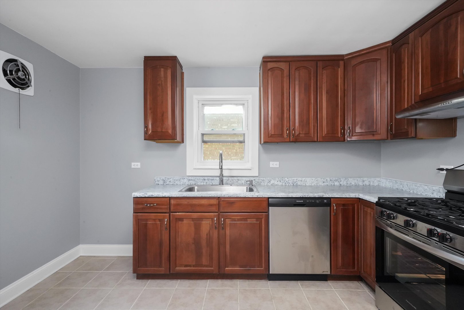 4353 West Marquette Road Chicago, IL 60629 - Photo 16 of 47 a kitchen with a sink and a stove top oven