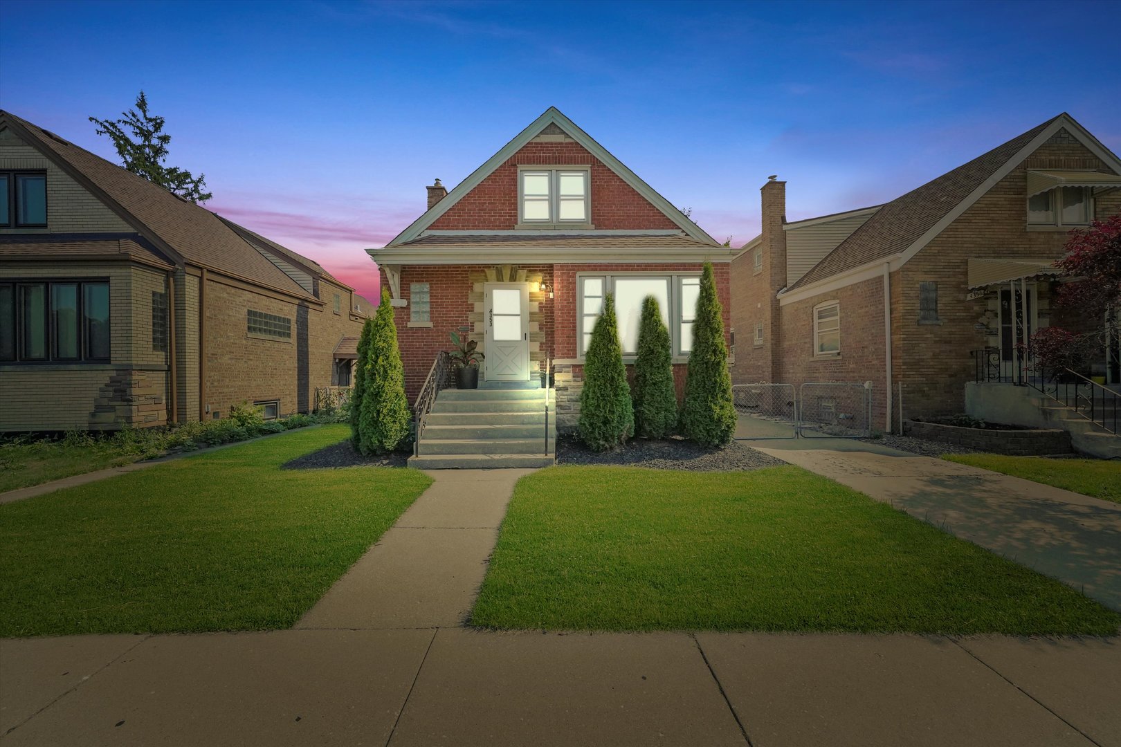 4353 West Marquette Road Chicago, IL 60629 - Photo 2 of 47 a front view of a house with a yard