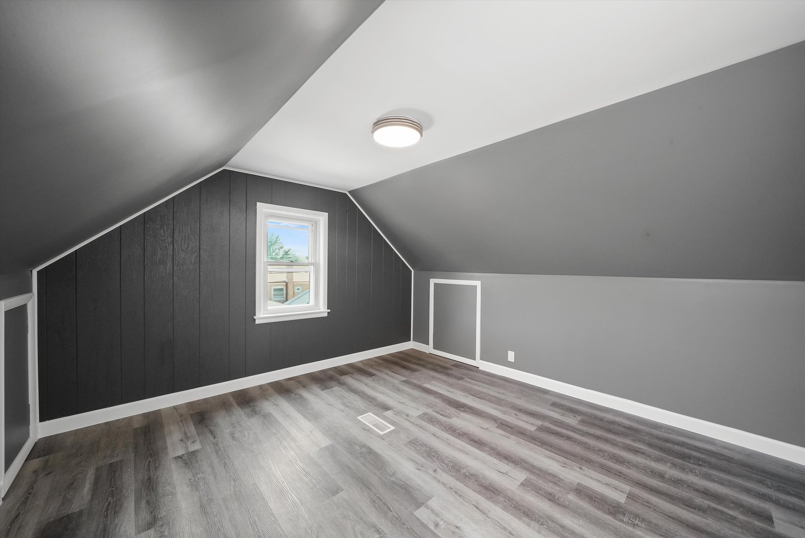 4353 West Marquette Road Chicago, IL 60629 - Photo 24 of 47 a view of an empty room with wooden floor and a window