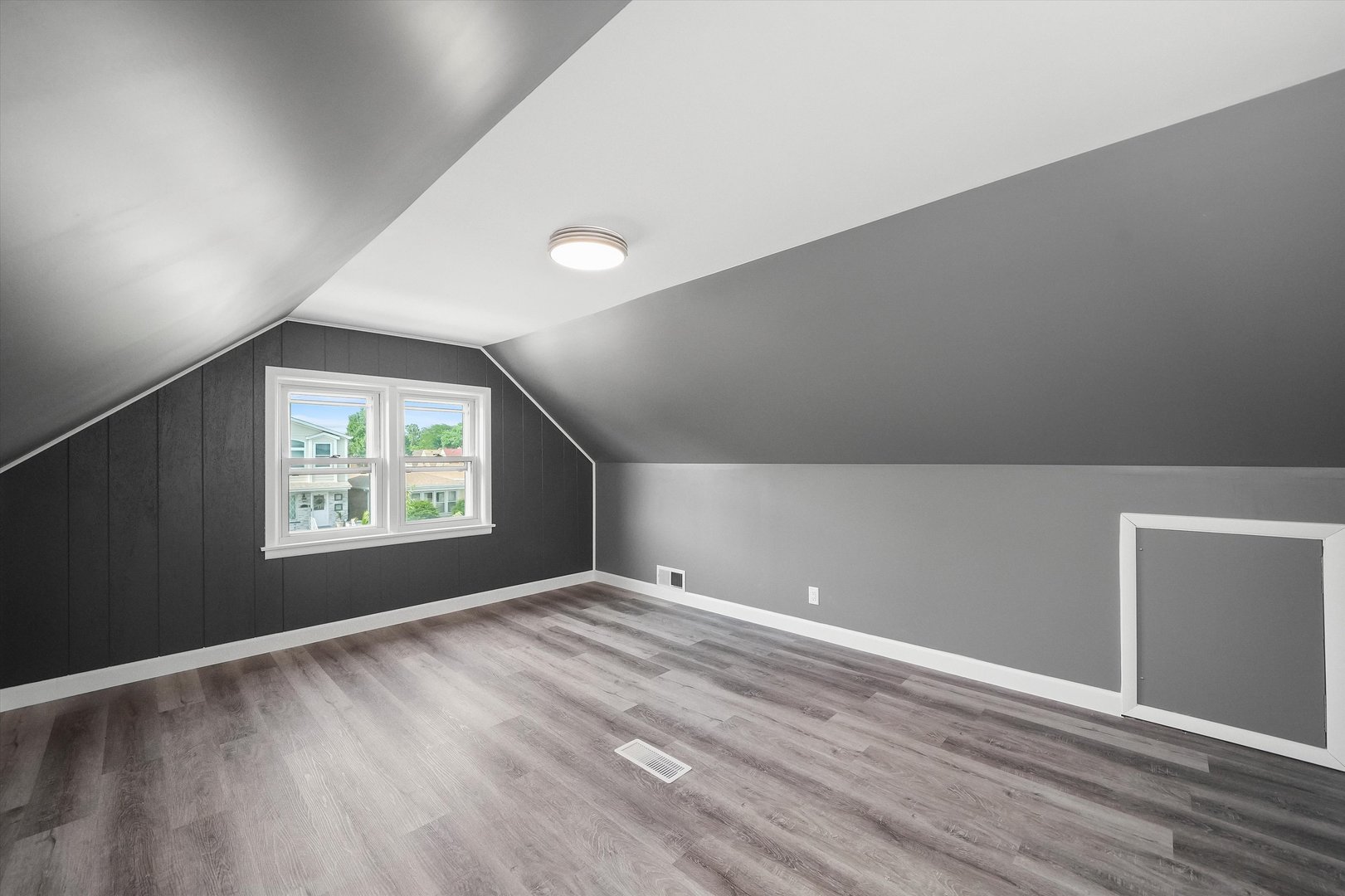 4353 West Marquette Road Chicago, IL 60629 - Photo 26 of 47 a view of an empty room with window and wooden floor