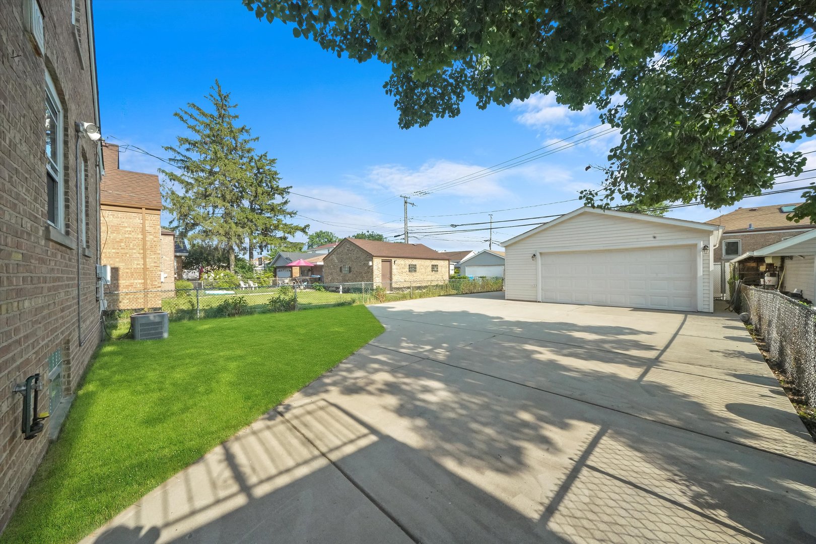 4353 West Marquette Road Chicago, IL 60629 - Photo 40 of 47 a front view of a house with a yard and garage