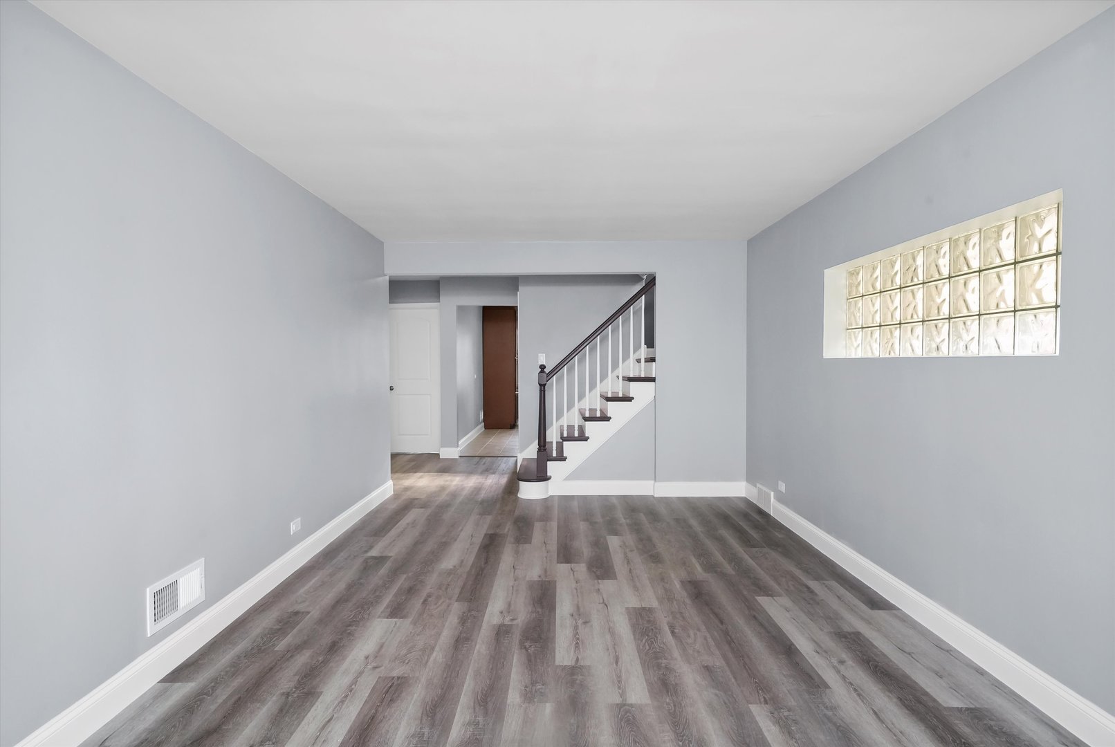 4353 West Marquette Road Chicago, IL 60629 - Photo 9 of 47 wooden floor in an empty room with a window