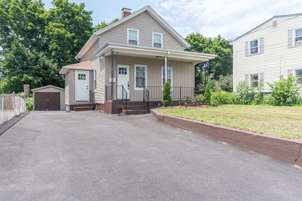 260 High Street Cumberland, RI 02864 - Photo 1 of 42 a view of a house with backyard and garden