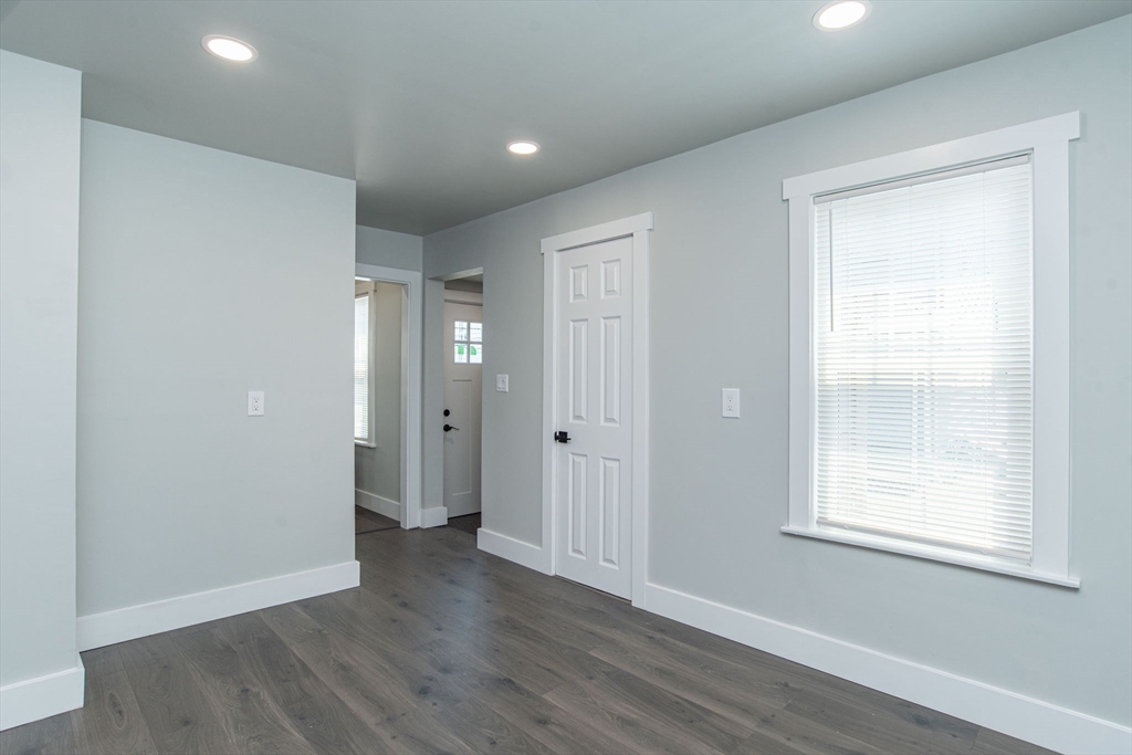 260 High Street Cumberland, RI 02864 - Photo 12 of 42 a view of an empty room with wooden floor and a window