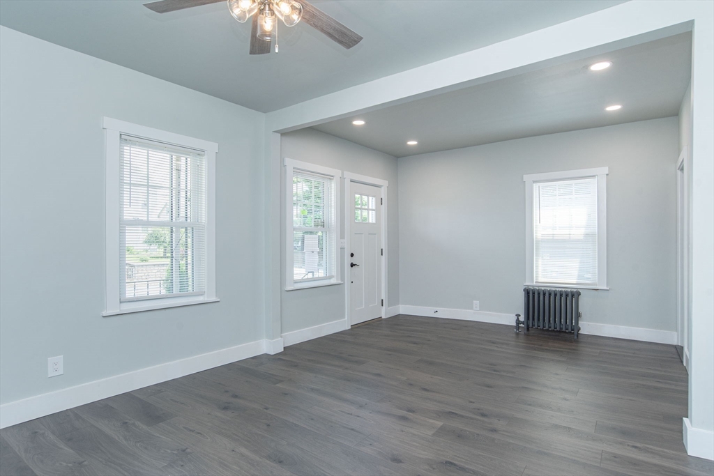 260 High Street Cumberland, RI 02864 - Photo 18 of 42 wooden floor in an empty room with a window