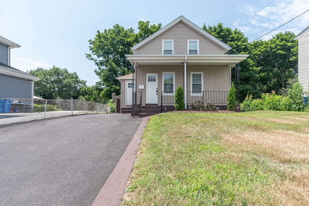 260 High Street Cumberland, RI 02864 - Photo 3 of 42 a front view of a house with a yard