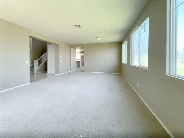 a view of entryway and hall with a window