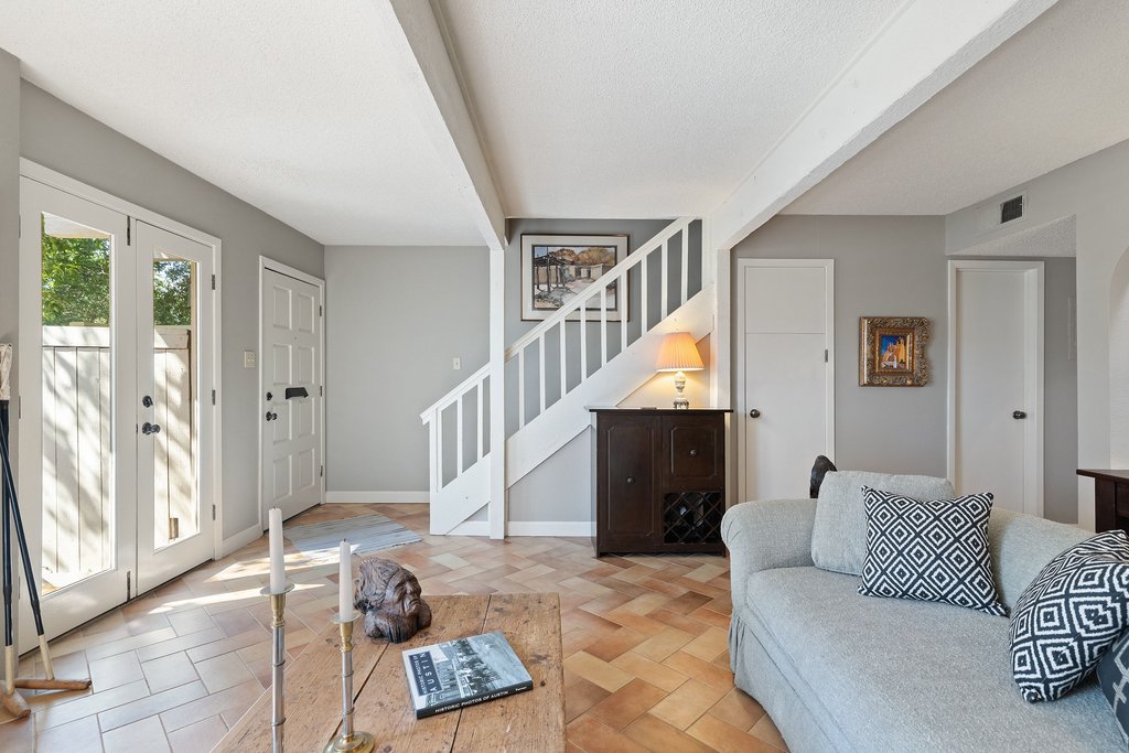 3500 Enfield Road, Unit E Austin, TX 78703 - Photo 10 of 40 Crisp white millwork and a graceful staircase lend a sense of light-filled sophistication to the entry, perfectly capturing the timeless charm that defines Tarrytown living.