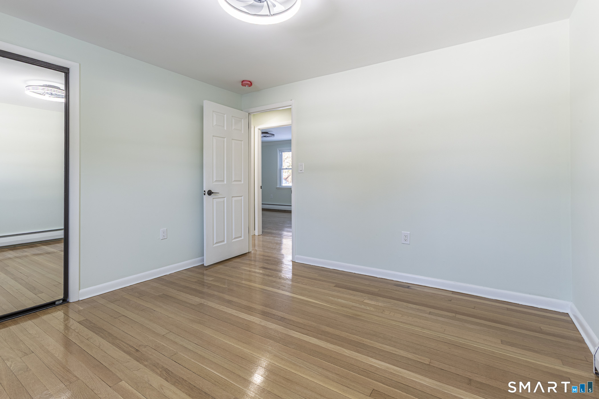 26 Kelly Road Hamden, CT 06518 - Photo 17 of 37 a view of an empty room with wooden floor