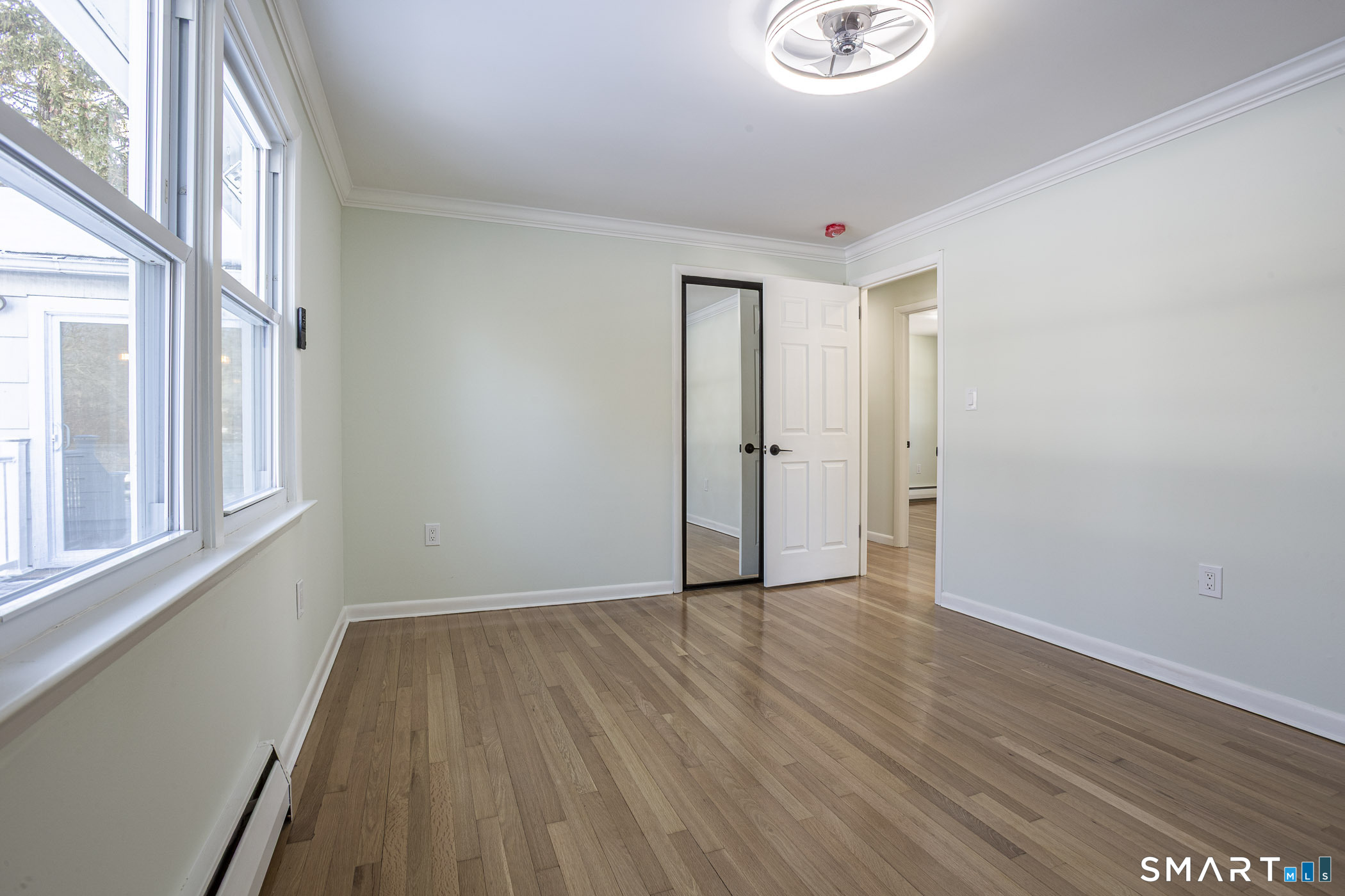 26 Kelly Road Hamden, CT 06518 - Photo 21 of 37 a very nice looking room with wooden floor and a window
