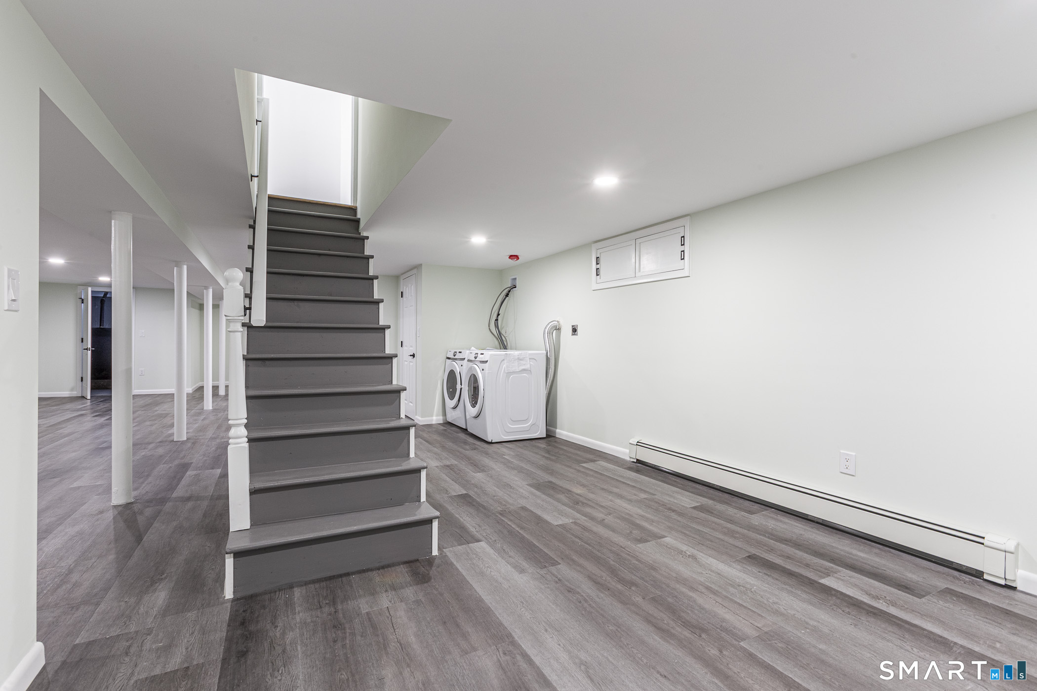 26 Kelly Road Hamden, CT 06518 - Photo 22 of 37 a view of entryway with stairs and wooden floor