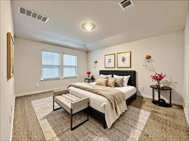 a bedroom with a bed and a couch