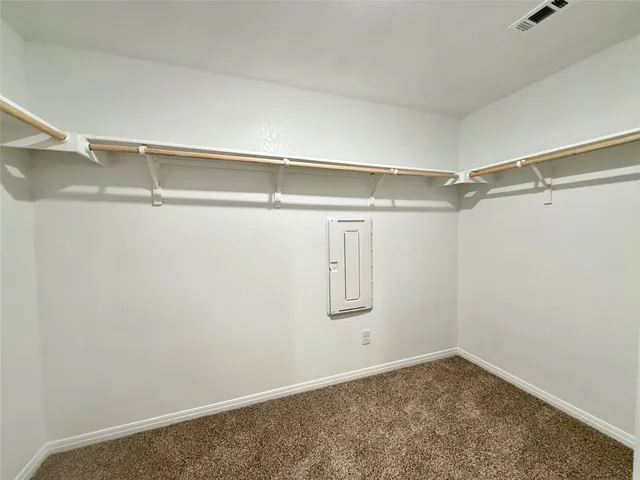 a view of an empty walk in closet