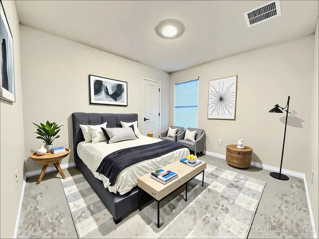 a bedroom with a bed and a couch