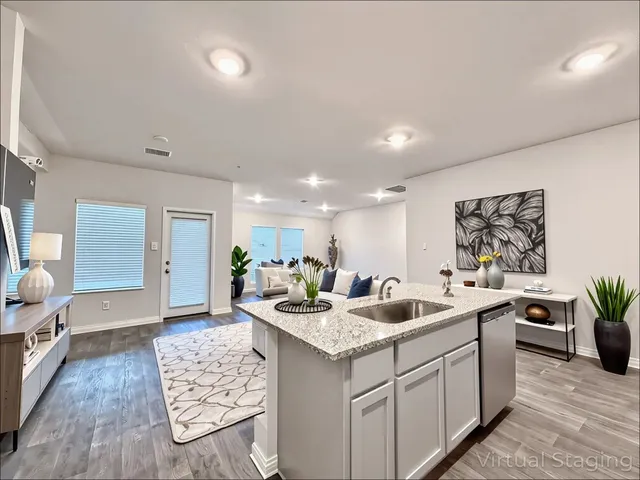 a kitchen with a sink and stove