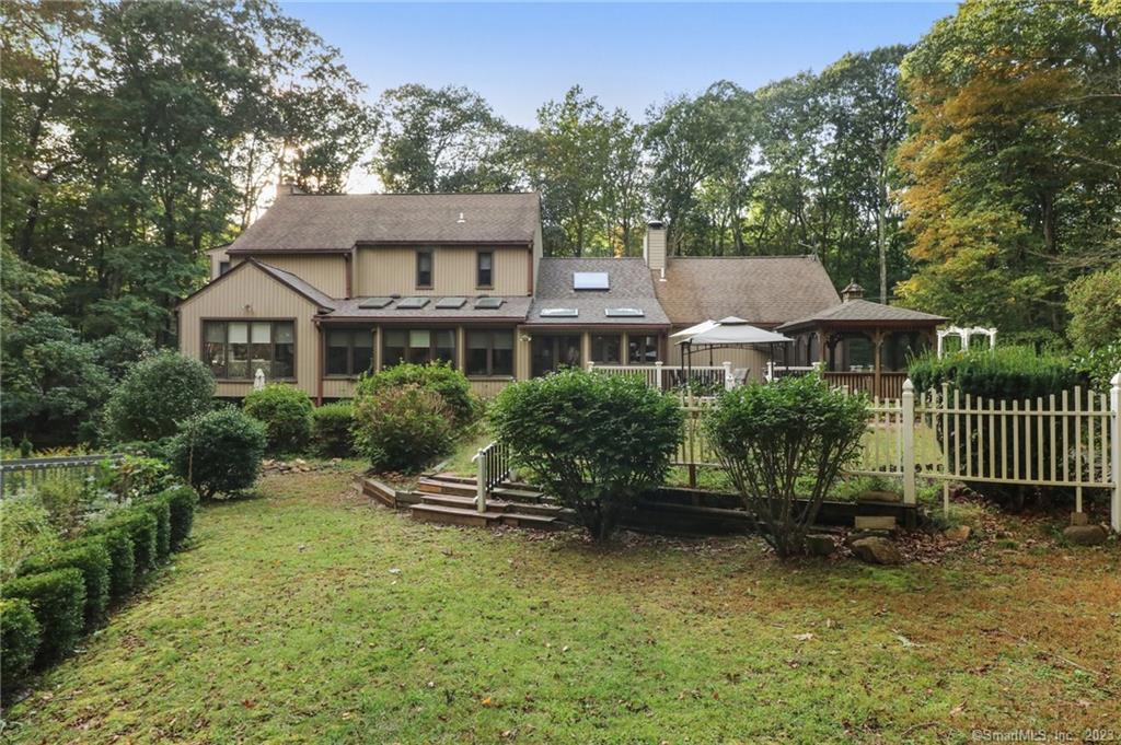 1563 Durham Road Guilford, CT 06437 - Photo 1 of 1 a front view of a house with a garden