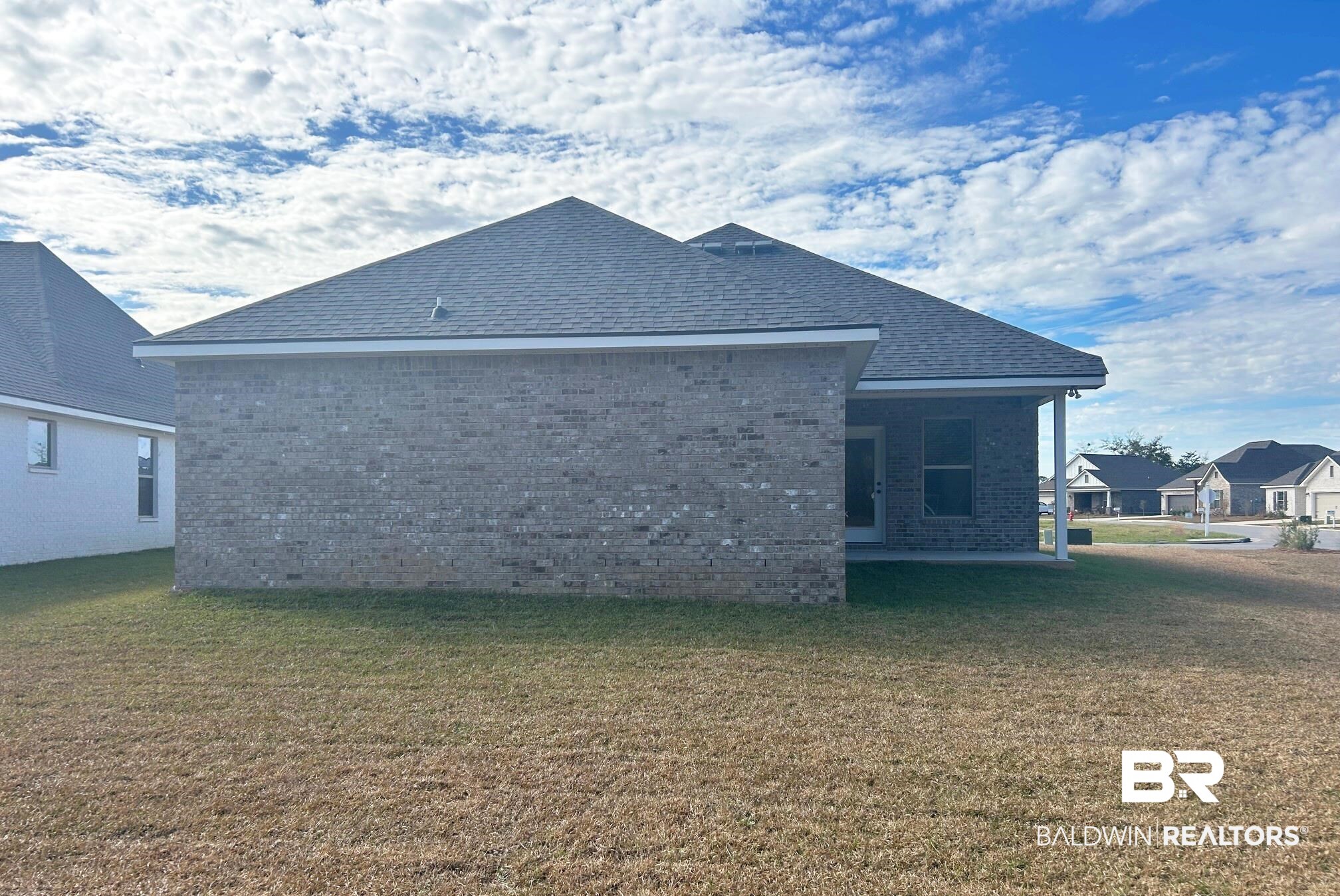 808 Sumter Loop Foley, AL 36535 - Photo 16 of 18 Rear view of house with a yard