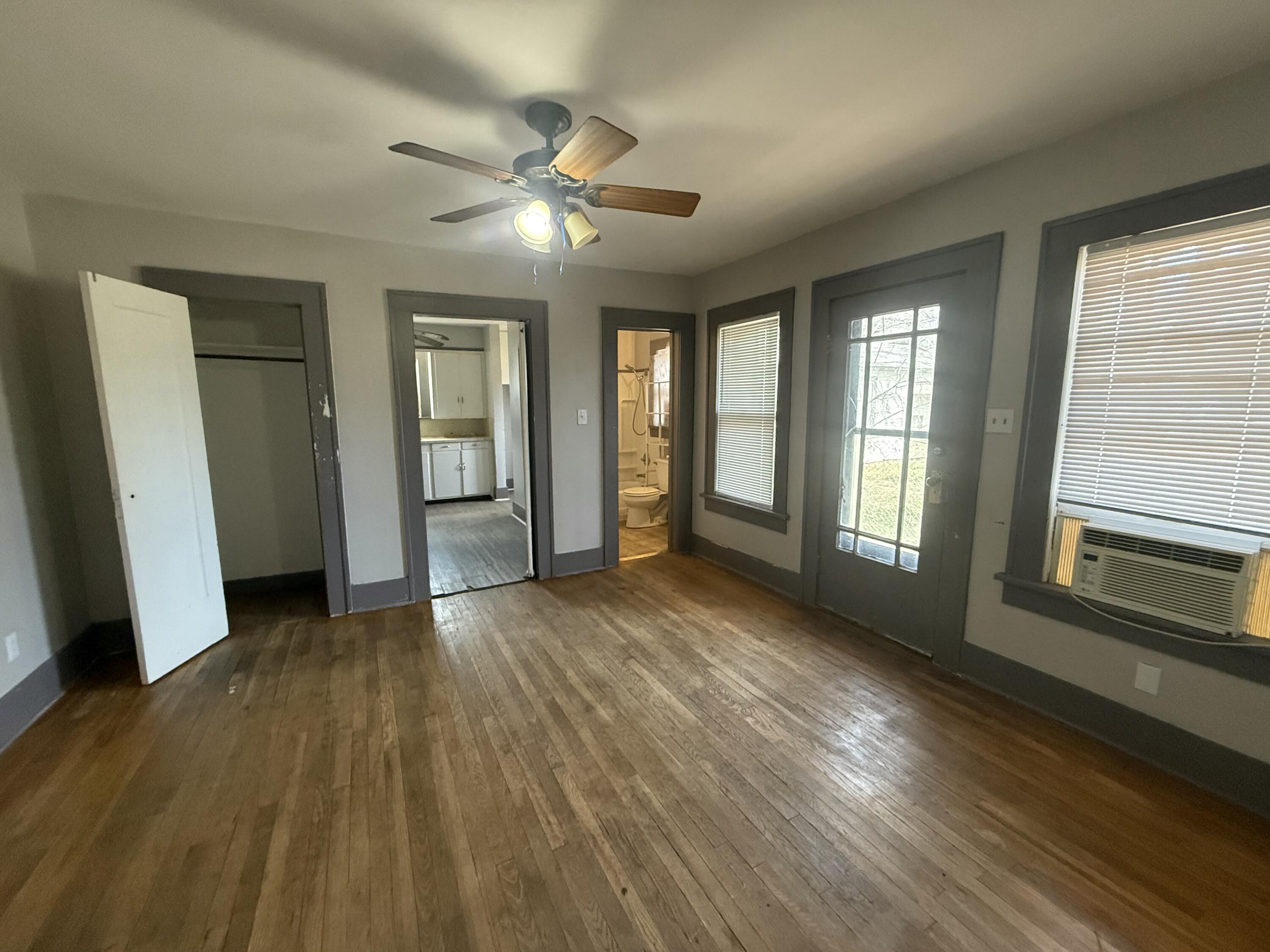 Package Package Property Lubbock, TX 79411 - Photo 67 of 71 a view of an empty room with wooden floor and a window