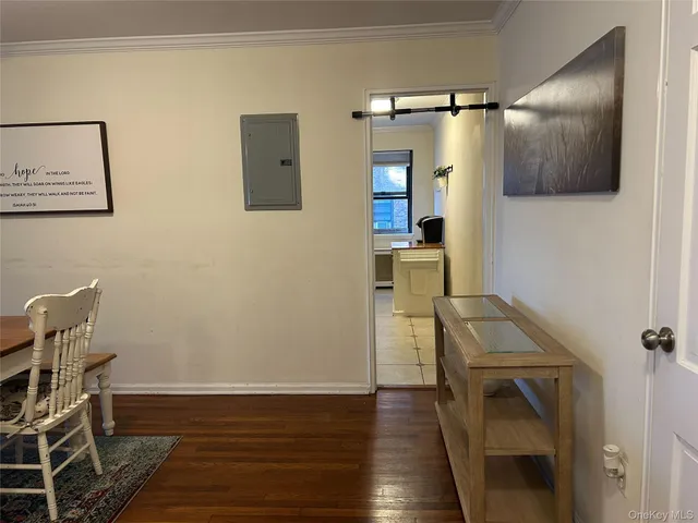 a view of a livingroom with furniture and wooden floor