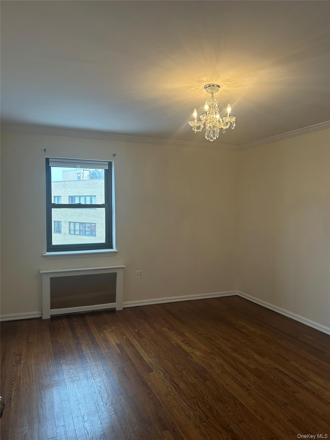 19 Old Mamaroneck Road, Unit 2J White Plains, NY 10605 - Photo 7 of 14 a room with hard wood floors and a window